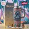 Grey Stitch tumbler with a 3D embossed character, metal straw, and Ohana Means Family text, standing next to a gift box.!