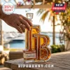 Glass Tampa Bay whiskey bottle in shape of letters TB on wood table with male hand holding the stopper.!