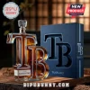 Tampa Bay themed T and B shaped glass whiskey bottle with matching navy blue presentation box on a wooden surface.!