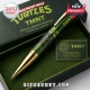 Teenage Mutant Ninja Turtles green metallic ballpoint pen with gold trim, turtle shell pattern, and character emblem.!
