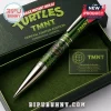 Green metal TMNT ballpoint pen with a circular Teenage Mutant Ninja Turtles icon and honeycomb pattern in a gift box.!