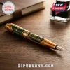 Teenage Mutant Ninja Turtle fountain pen with gold trim, green honeycomb pattern, and Michelangelo character illustration.!