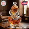 Faceted crystal decanter shaped like a dog head wearing a Tennessee Volunteers orange and white checkerboard baseball cap.!