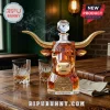 Amber glass bull head decanter with gold horns, faceted texture, and an engraved 133rd anniversary plaque on a table.!