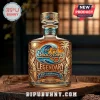The Beach Boys 65th anniversary amber glass liquor bottle featuring gold embossed surfboards, palm trees, and microphones.!