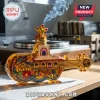 Amber glass Yellow Submarine shaped incense holder featuring psychedelic floral art and portraits of the four Beatles members.!