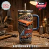 Dukes of Hazzard 47th anniversary stainless steel tumbler with General Lee car, text, and blue leather handle on wood table.!