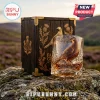 The Famous Grouse whiskey glass and wooden box set with embossed bird and thistle motifs on a rocky outdoor background.!
