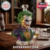 Joker-shaped faceted crystal whiskey decanter with green hair and purple suit on a leather desk in a library setting.!