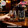 Kraken Black Spiced Rum being poured into a custom glass featuring a raised black octopus tentacle relief design.!