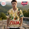 Man wearing a cream-colored short-sleeve button-up shirt featuring The Legend of Zelda 40th anniversary graphic print.!