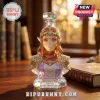Legend of Zelda 40th anniversary Princess Zelda glass decanter with gold trim and Triforce crest on a wooden desk.!