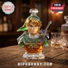 Crystal Legend of Zelda Link decanter with Master Sword and 40th Anniversary text on a wooden table.!