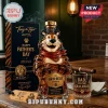 Tony the Tiger shaped glass whiskey bottle with matching glass and black gift box with gold text on a wooden table.!