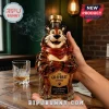 Tony the Tiger shaped whiskey bottle made of amber glass with a gold cap and a red scarf held by human hands.!