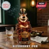Tony the Tiger shaped glass whiskey bottle with gold stopper, gold label reading The Gr-r-reat Choice on wooden table.!