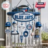 Toronto Blue Jays commemorative wind chime featuring Rogers Centre, Vladimir Guerrero Jr. figure, and World Series trophies.!