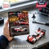 1:64 scale Toyota GR010 Hybrid Le Mans winning hypercar die-cast model in blister packaging on a metal workspace.!