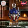 Transformers Optimus Prime head-shaped whiskey bottle with blue, silver, and red accents on a marble table.!