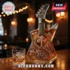 U2 50th anniversary guitar-shaped glass whiskey bottle with Joshua Tree etching and matching Zoo TV rocks glass on bar top.!