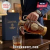 UEFA Champions League 71st anniversary whiskey decanter with gold metal accents pouring amber liquid into a glass tumbler.!