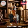 Uncle Sam shaped glass decanter filled with amber liquid, topped with a detailed metallic gold crown stopper.!