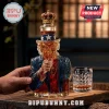 Uncle Sam shaped glass whiskey decanter with red, white, and blue detailing, gold crown topper, and textured glass tumbler.!
