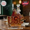 USC Trojan mascot glass whiskey decanter with sword and diamond-shaped stopper on a wooden table.!