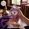 Faceted purple glass husky dog decanter with gold W logo and Bow Down to Washington text held in human hands.!
