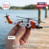 Die-cast U.S. Coast Guard helicopter model held in hand, featuring orange and white fuselage with 6002 identification.!