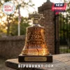 Amber glass Liberty Bell decanter etched with USA 250th anniversary text, 1776-2026, and eagles on a wooden base.!