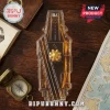 Aircraft carrier shaped glass whiskey decanter filled with amber liquid on a dark wooden desk with a vintage compass.!