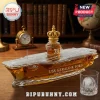USS Gerald R. Ford CVN-78 glass whiskey decanter filled with amber liquid and a gold crown topper on a wooden desk.!