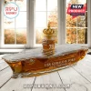 USS Gerald R. Ford CVN-78 glass whiskey decanter shaped like an aircraft carrier with a gold crown stopper on wood table.!