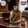 Golden Misfits 10th anniversary whiskey decanter with geometric helmet design, glass stopper, and Vegas Golden Knights logos.!