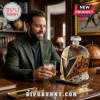 The Golden Misfits faceted glass whiskey decanter shaped like a hockey goalie mask on a wooden desk with a man.!