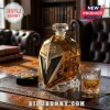 Gold metallic faceted whiskey decanter shaped like a knight helmet, inscribed with The Golden Misfits 10th Anniversary.!