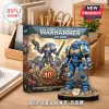 Warhammer 40,000 40th anniversary collector edition box set with blue Space Marine action figure on a wooden desk.!