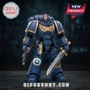 Ultramarines Primaris Space Marine action figure in blue power armor with gold trim, chainsword, and bolter on dark base.!