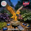 Illuminated golden eagle solar garden statue with a blue and yellow bandana on a rock base reading Eagles 40th Anniversary.!