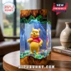 Winnie the Pooh figurine inside a rectangular resin and wood lamp with green moss base and swirling blue smoke effect.!