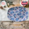 Oval serving platter featuring a light blue Eeyore pattern with small butterflies on a rustic wooden table background.!