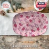 Oval ceramic serving platter featuring a repeating pink Piglet pattern from Winnie the Pooh on a rustic wooden table.!