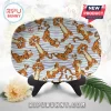 Tigger oval serving plate featuring Disney 100 Years logo and repeating orange tiger character pattern on white background.!