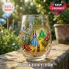 Wizard of Oz 87th anniversary stemless wine glass featuring Dorothy, Tin Man, Lion, and Emerald City illustration.!