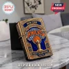 Gold-tone metal Zippo-style lighter featuring New York Knicks basketball logo, championship trophy, and 2026 text.!