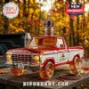 Amber glass 1979 Ford F-150 truck bottle with a Crown Royal cap and purple crown topper on a wooden table.!