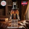 Rock musician styled glass decanter featuring a black top hat, curly hair, sunglasses, and skull necklace on a leather chair.!