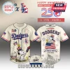 Los Angeles Dodgers cream baseball jersey and cap with Snoopy, Woodstock, fireworks, and American flag graphics.!