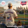 Los Angeles Dodgers cream-colored baseball jersey featuring Snoopy in a patriotic hat with an American flag background.!